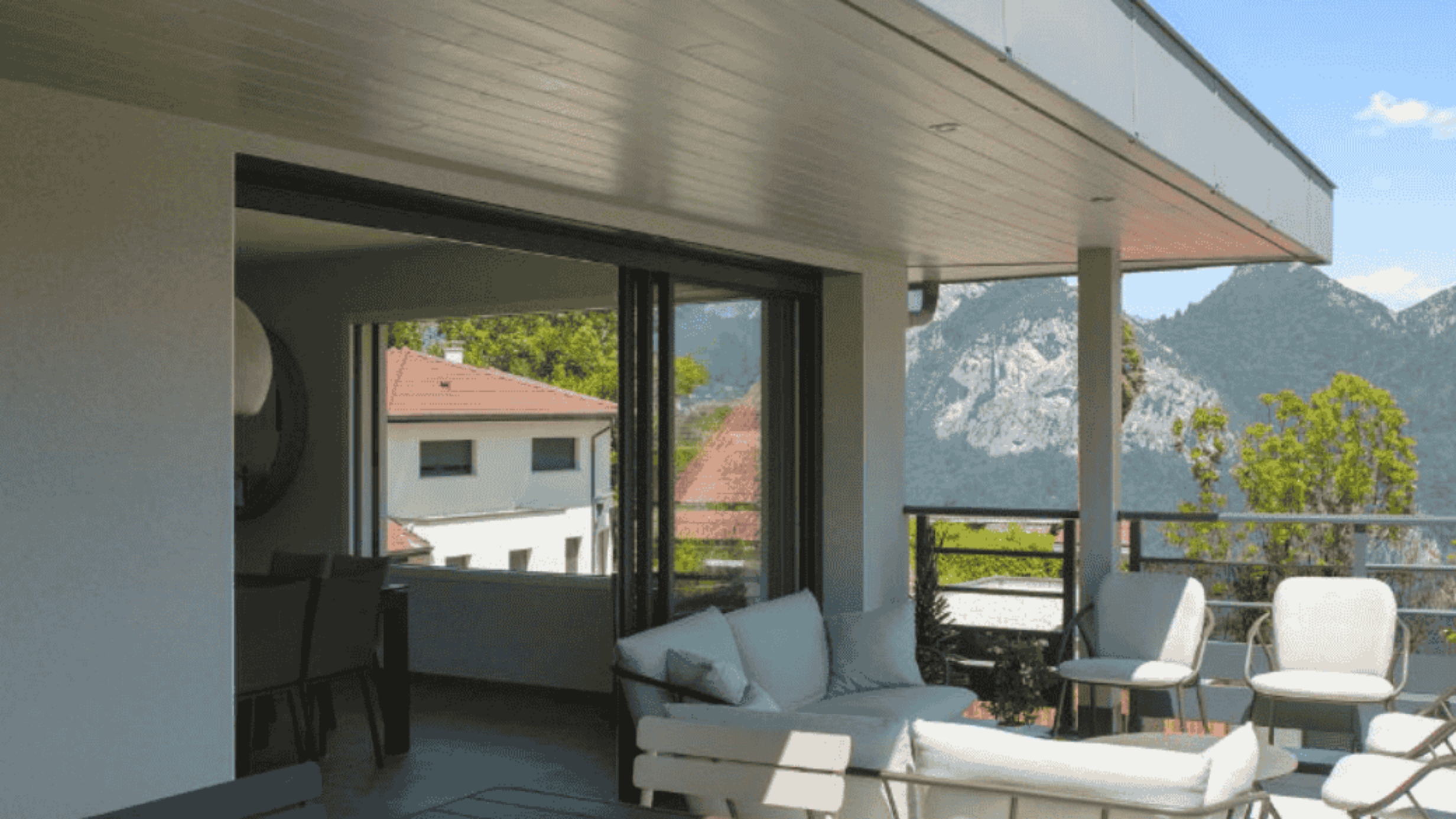 balcon avec salon ouvert sur l exterieur et vue sur la vallee